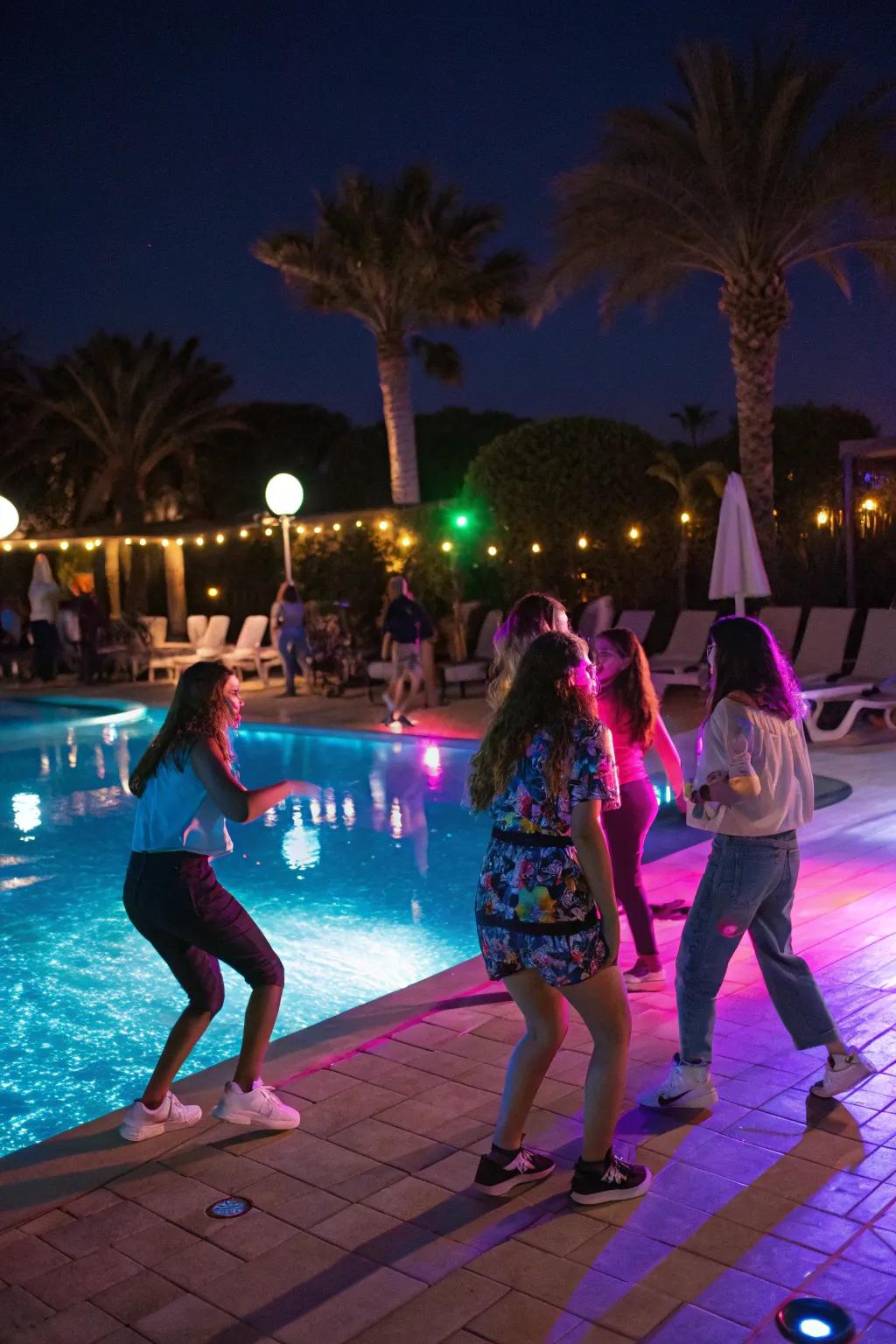 A lively poolside dance party with vibrant lighting and music.