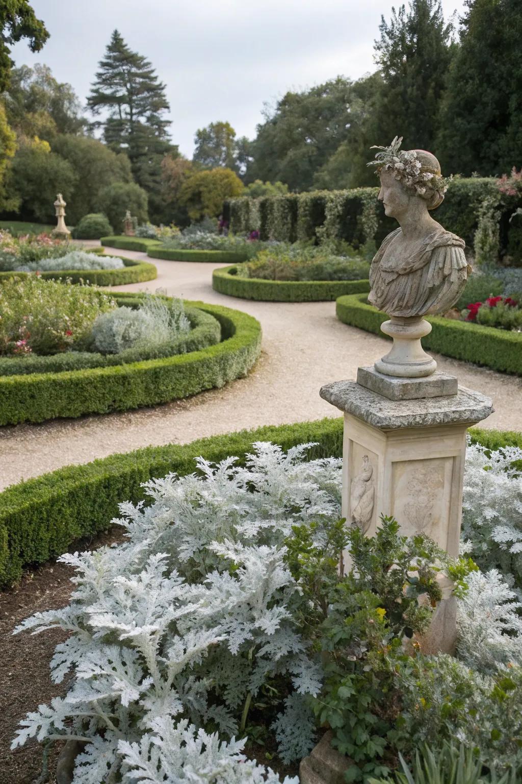 Dusty miller accentuates garden sculptures beautifully.