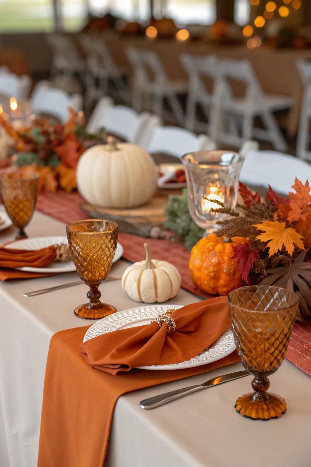 Elegant gem tone glassware at a fall wedding table.