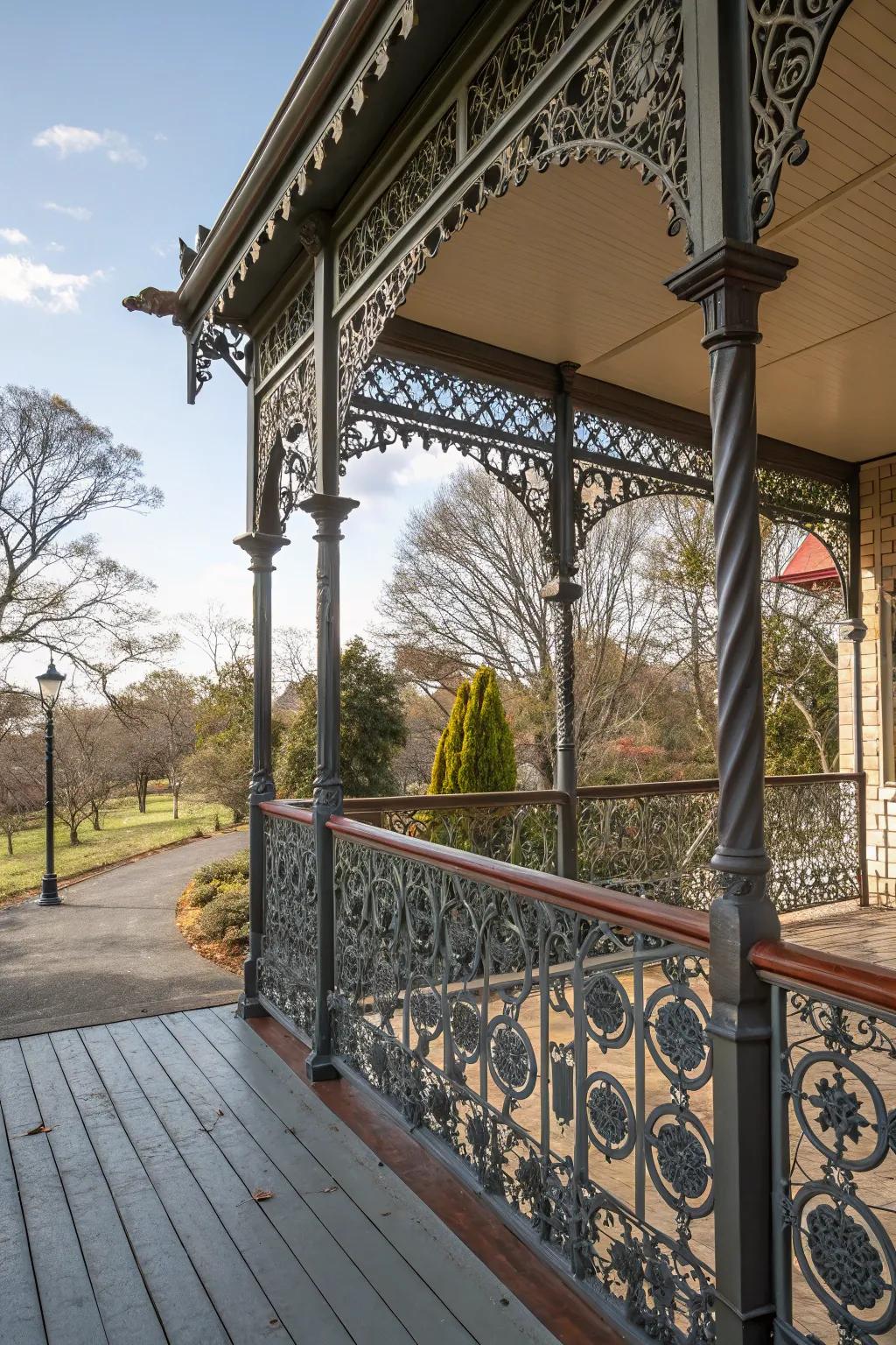 A metal porch with artistic and intricate railings.