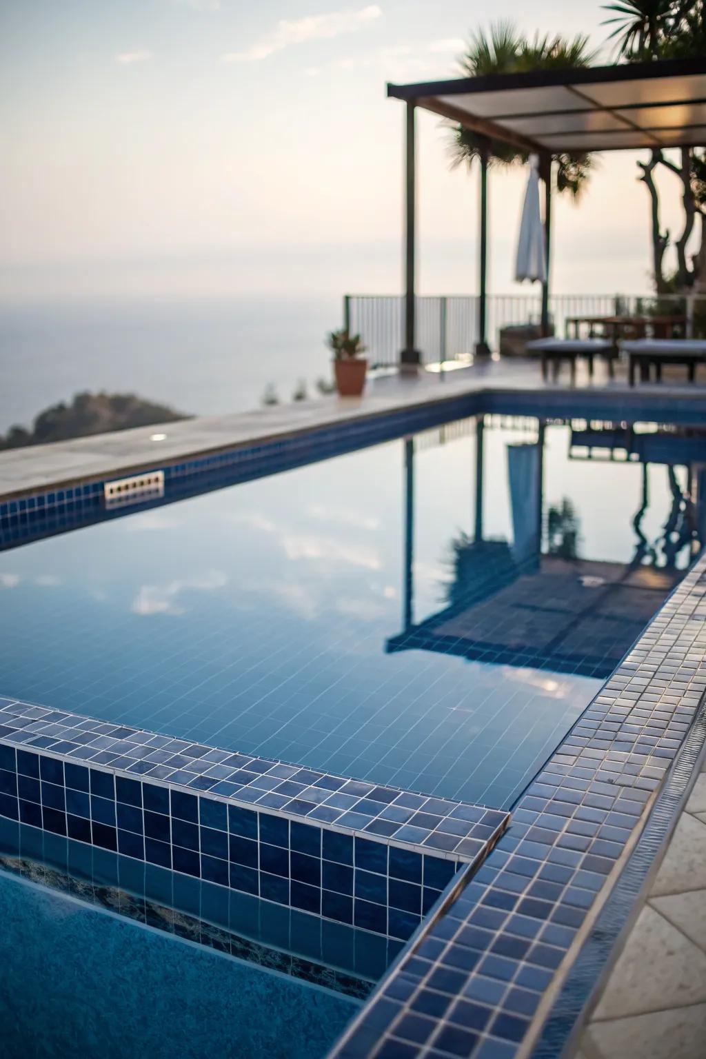 Reflective surfaces creating an expansive feel around a plunge pool.