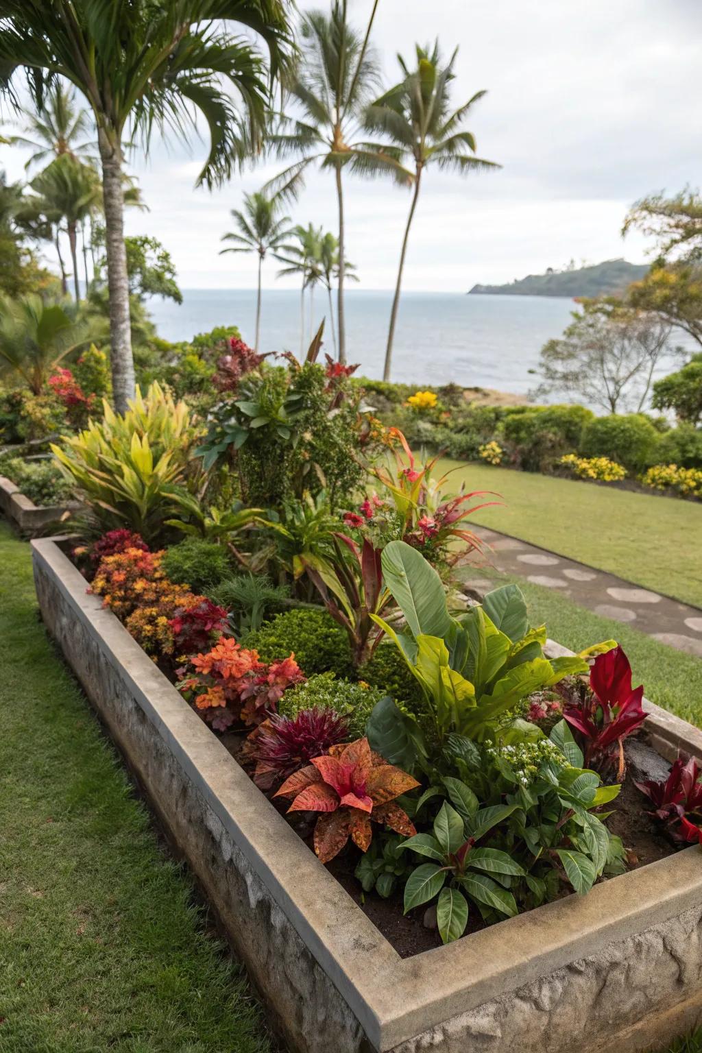 A tropical escape in a rectangular flower bed, filled with lush, exotic plants.