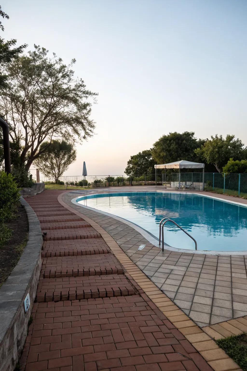 A charming brick pathway that enhances the pool's accessibility and style.