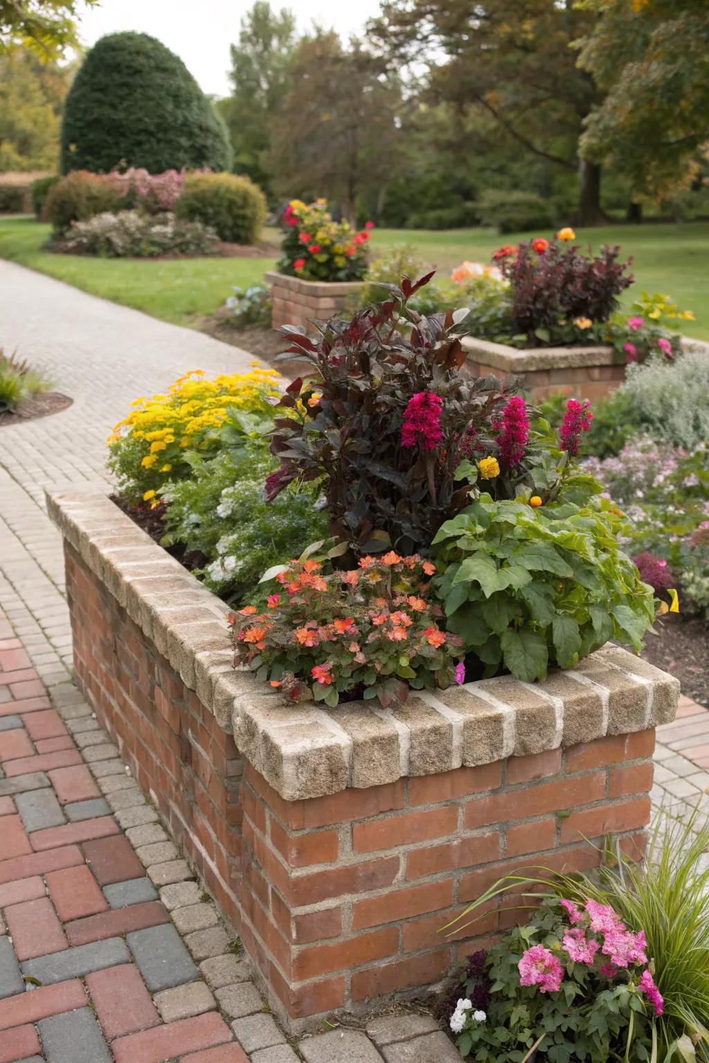 A brick planter featuring plants swapped with the changing seasons.