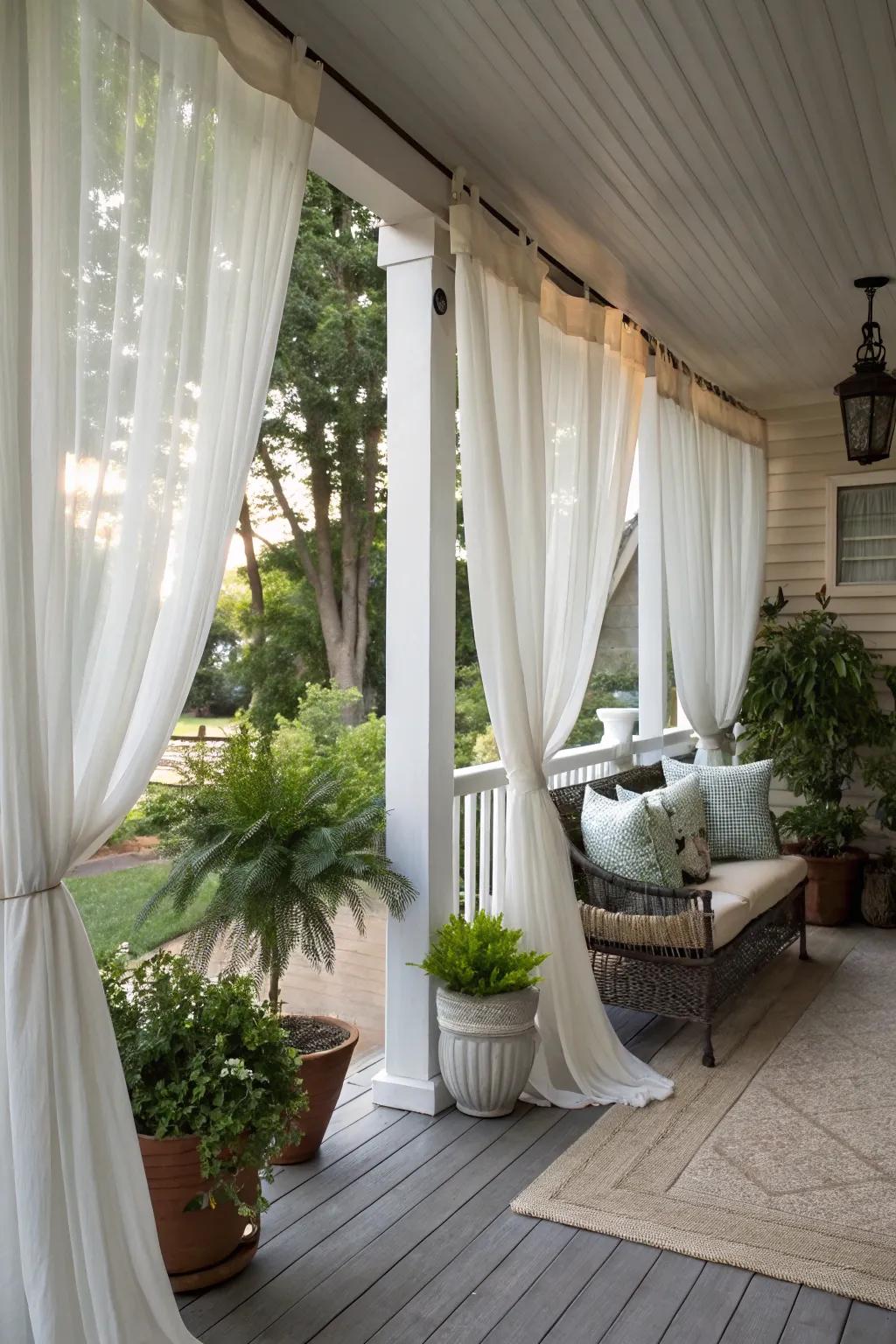 Curtains adding privacy and elegance to a corner porch.