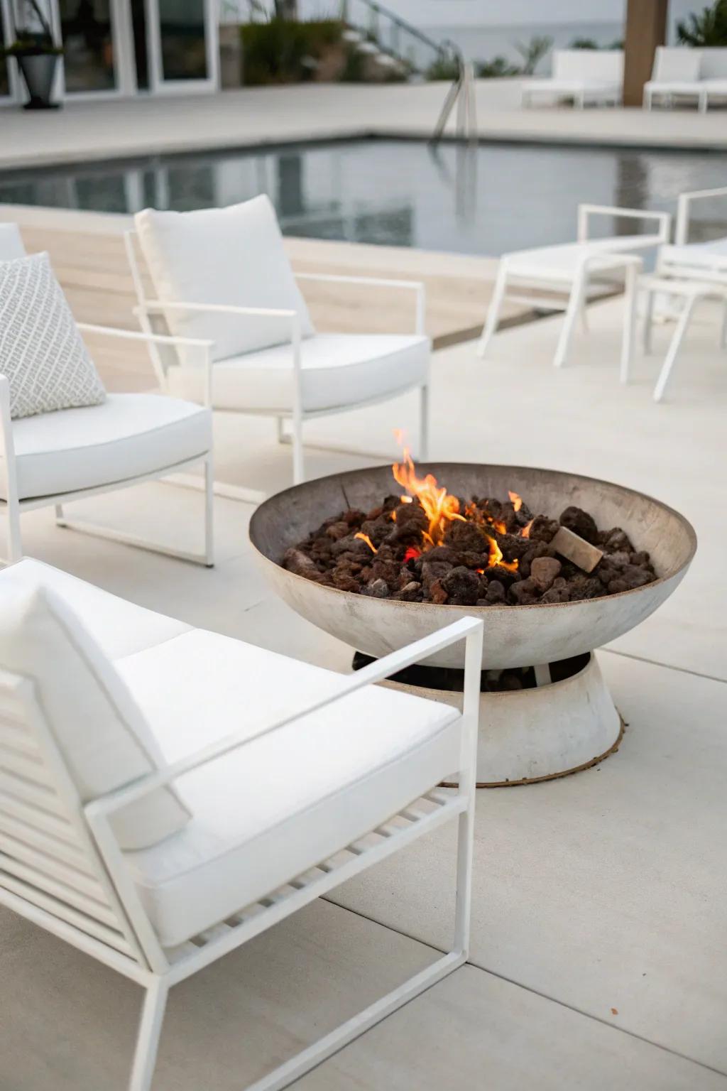 A sleek, minimalist metal fire pit setting.