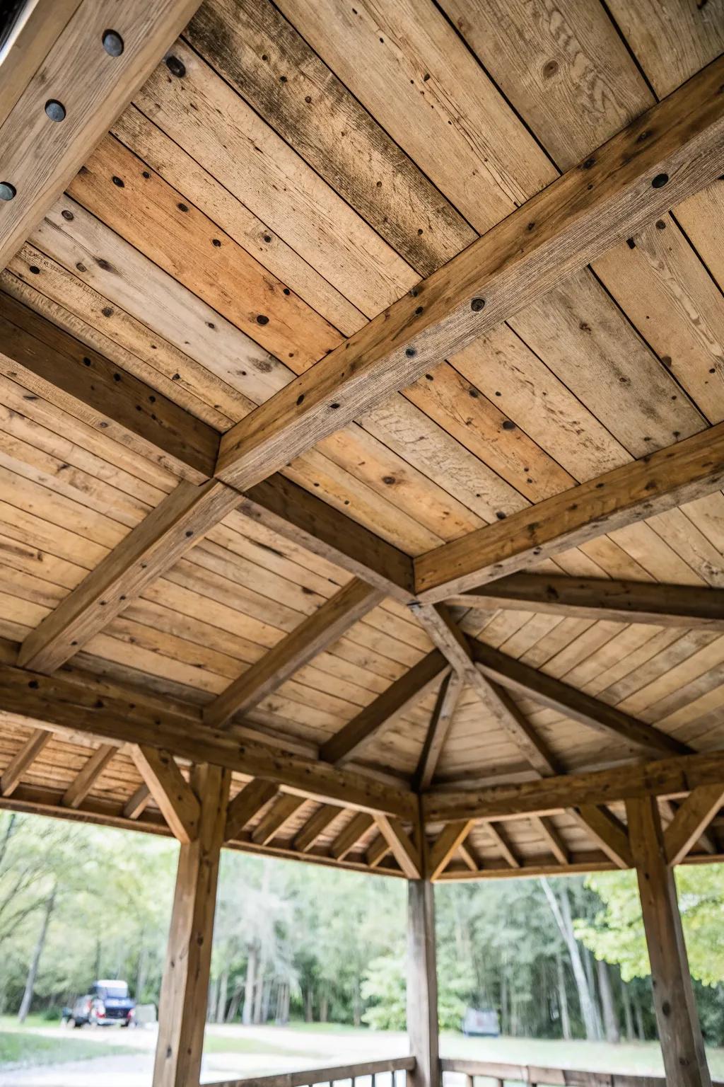 A pavilion ceiling crafted from reclaimed wood, adding character and sustainability.