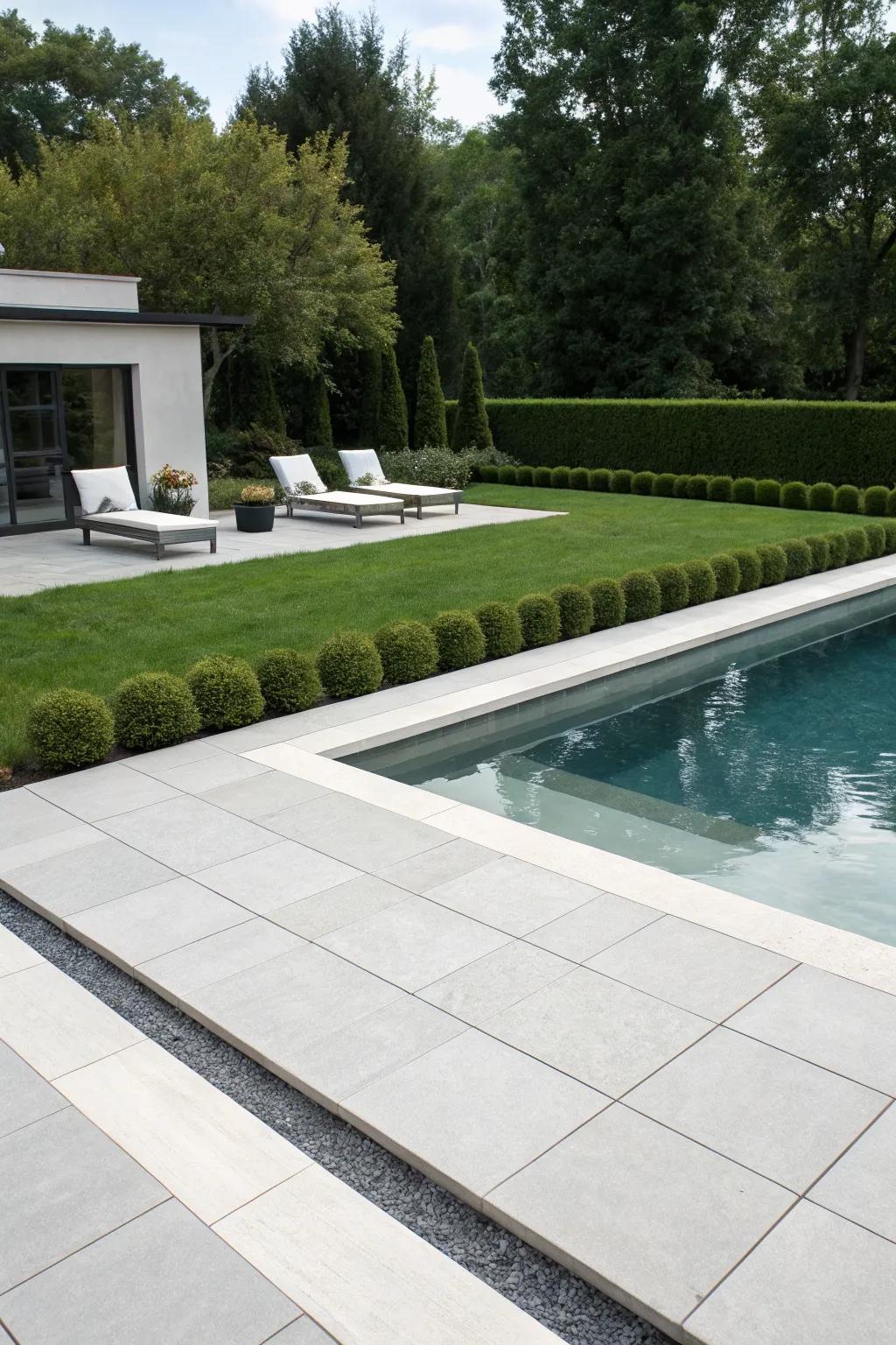 Minimalist lines create a clean and sophisticated pool deck aesthetic.