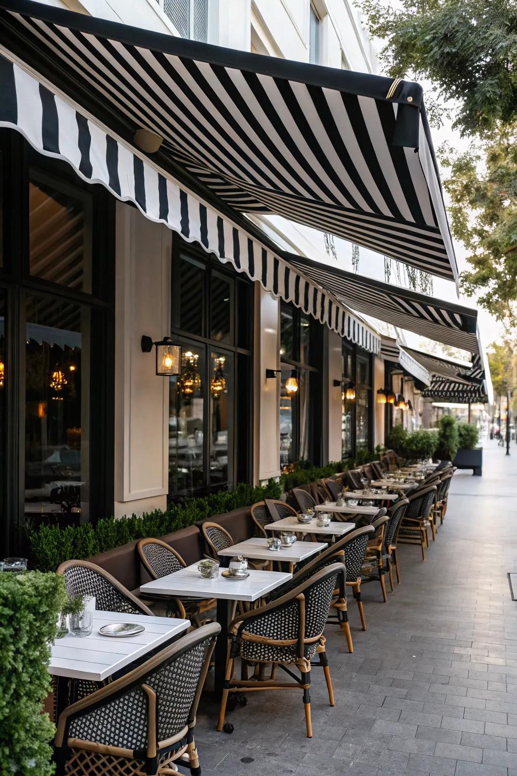 Black and white striped awnings bring elegance to this outdoor cafe.