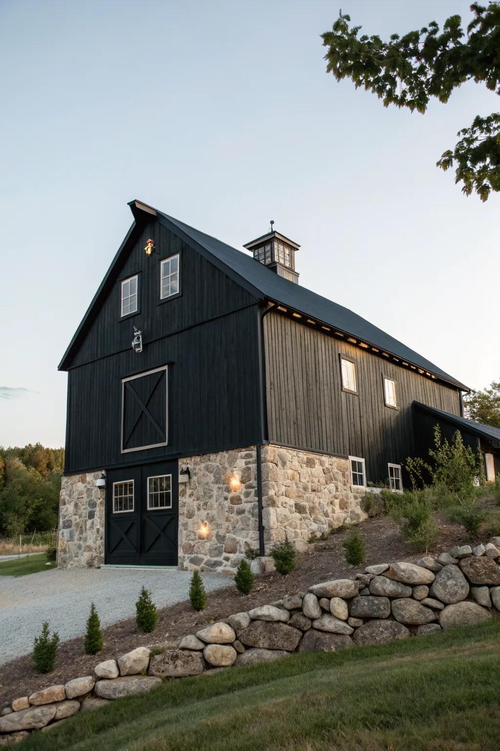 A black barn with natural stone accents providing an earthy look.