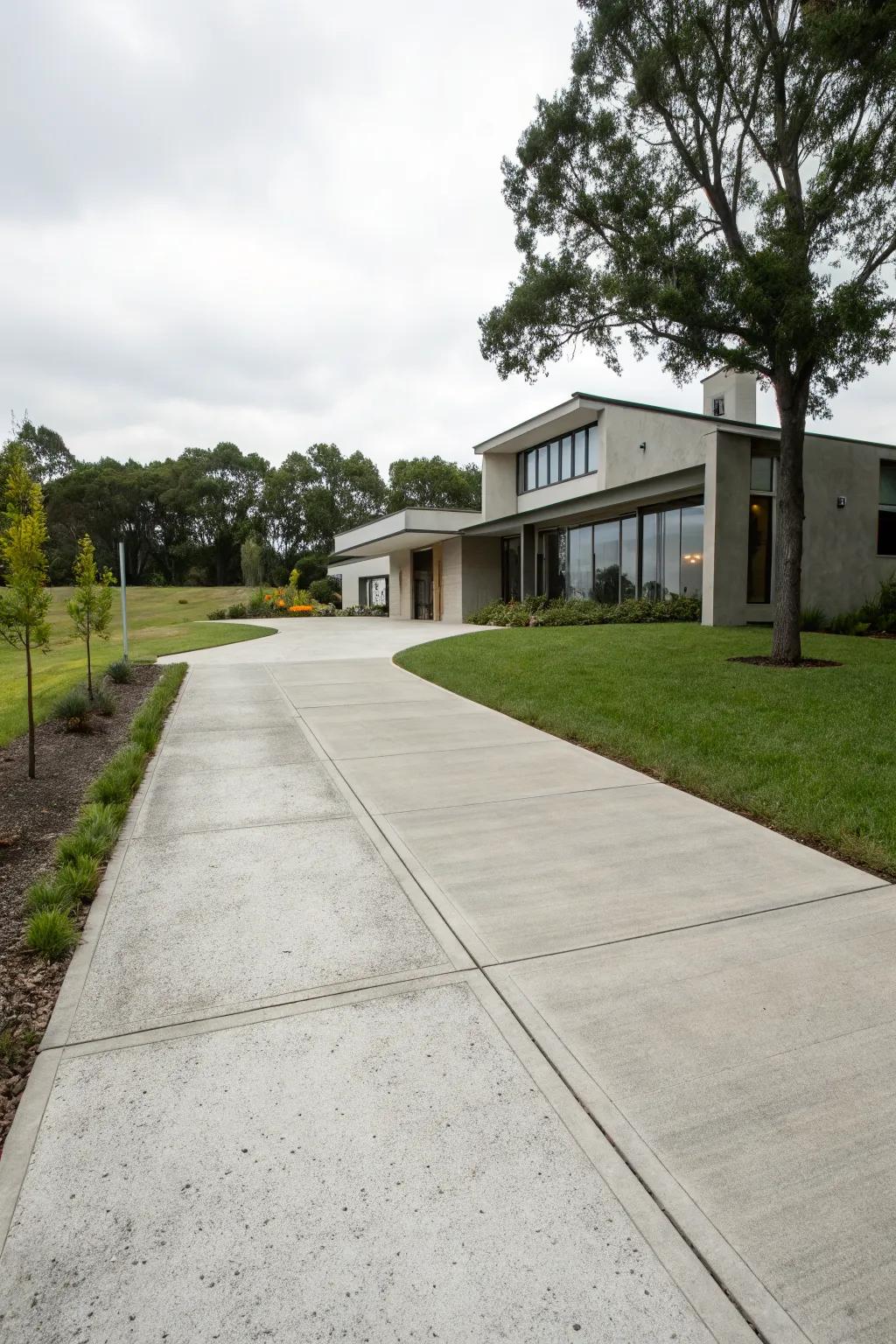 A sleek modern concrete driveway, perfectly complementing a contemporary country home.