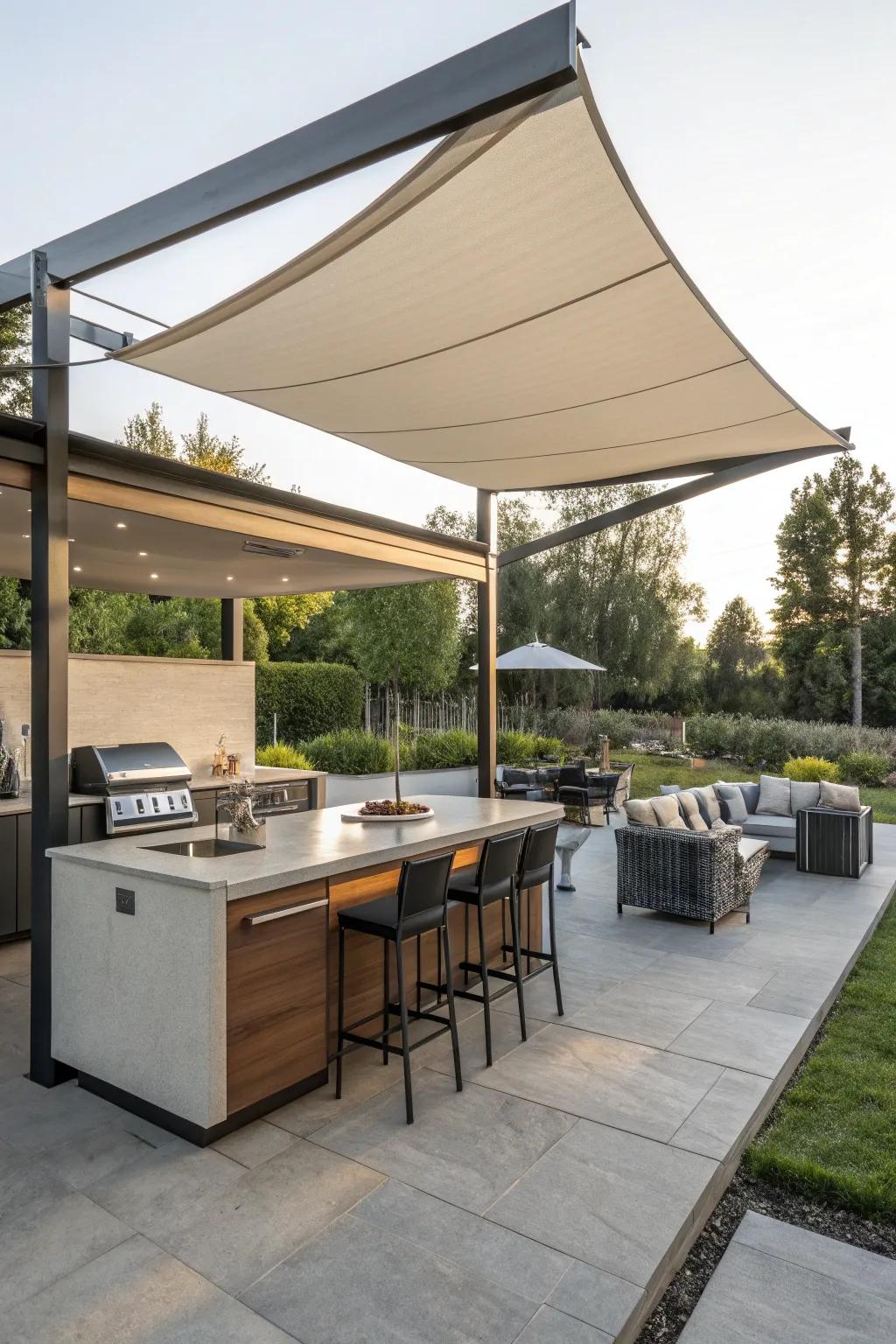 Freestanding shade sails add a modern, customizable touch to this outdoor kitchen.