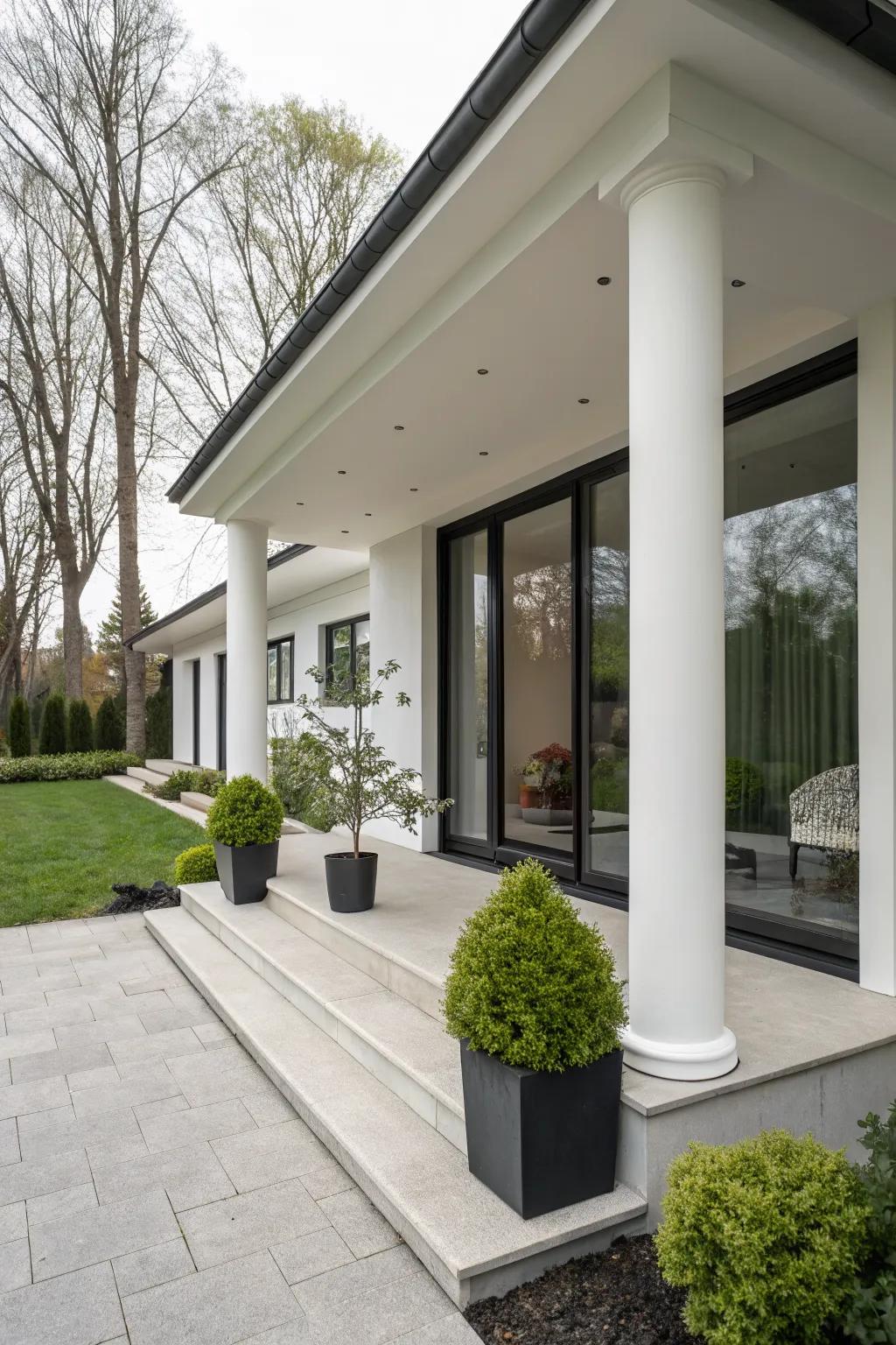 Minimalist columns provide a clean and sleek aesthetic to this modern porch.