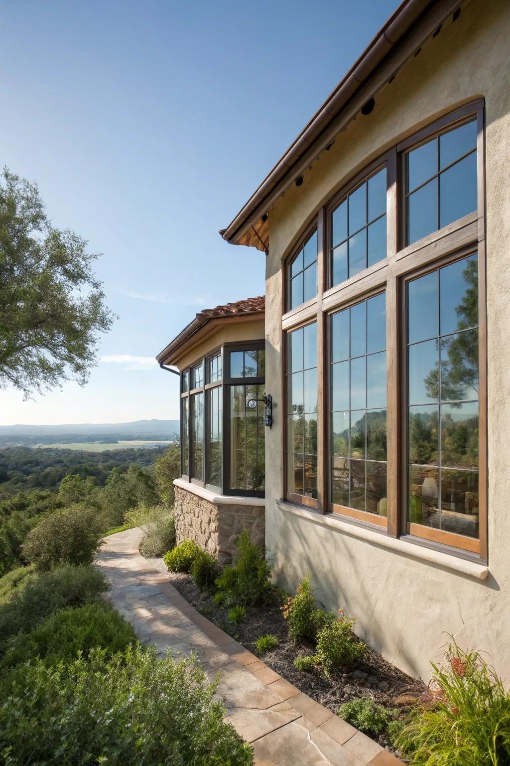 Stucco house with large, bright windows.