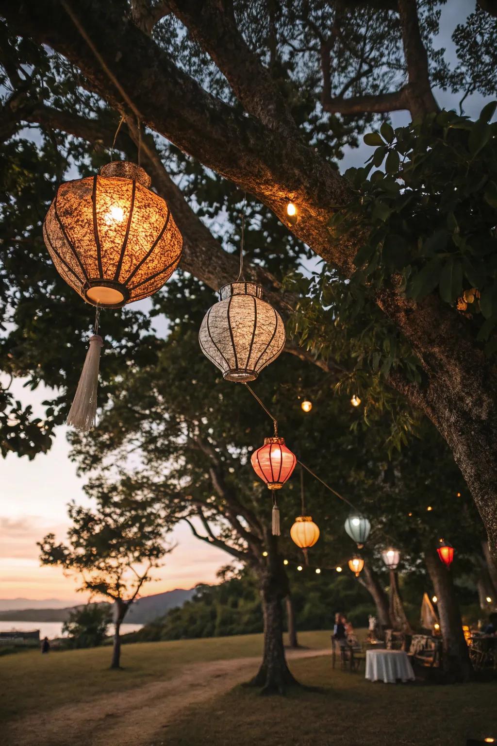 Lanterns hanging from trees add a magical glow to your garden.