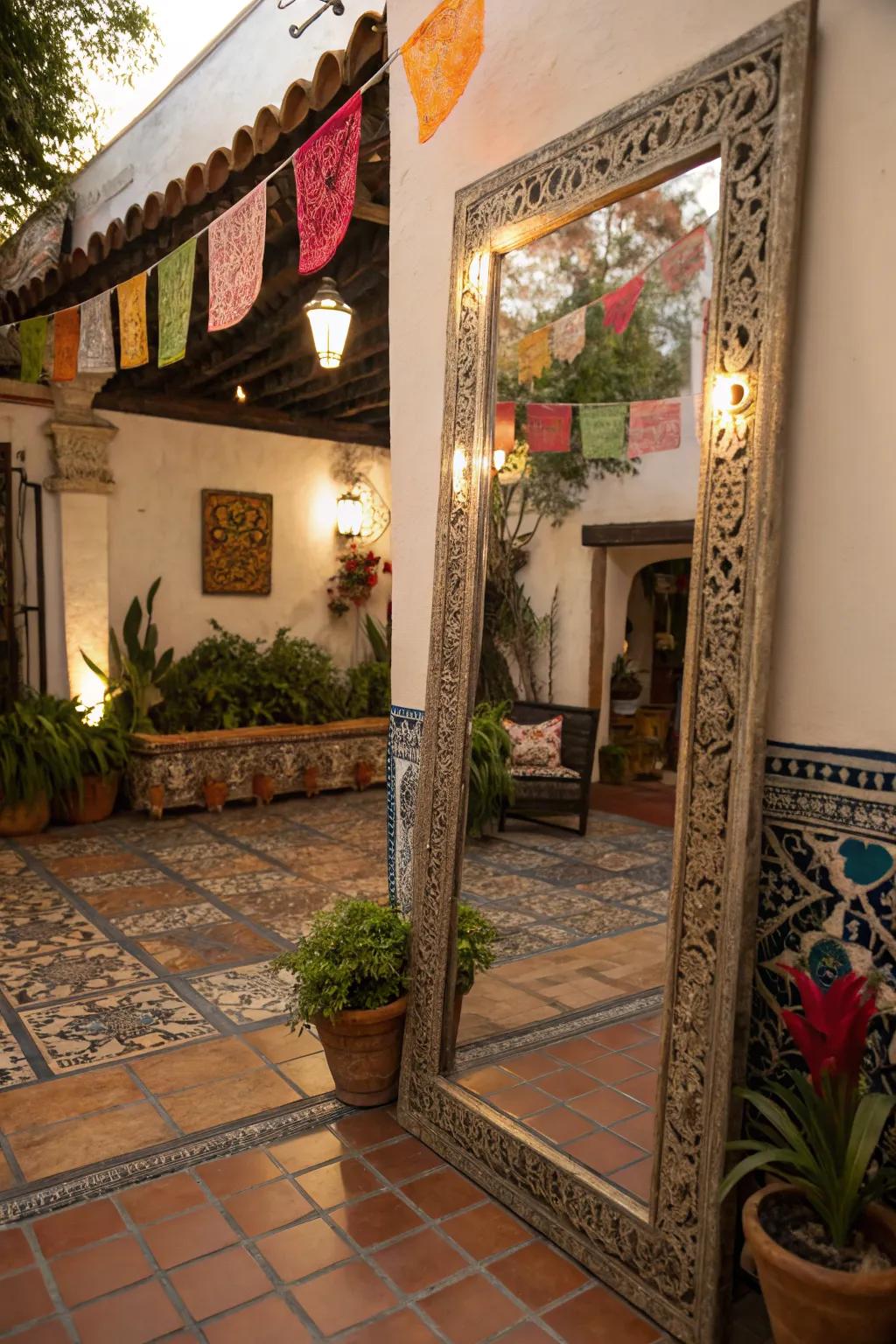 A Mexican patio with a large tin mirror reflecting light and expanding visual space.