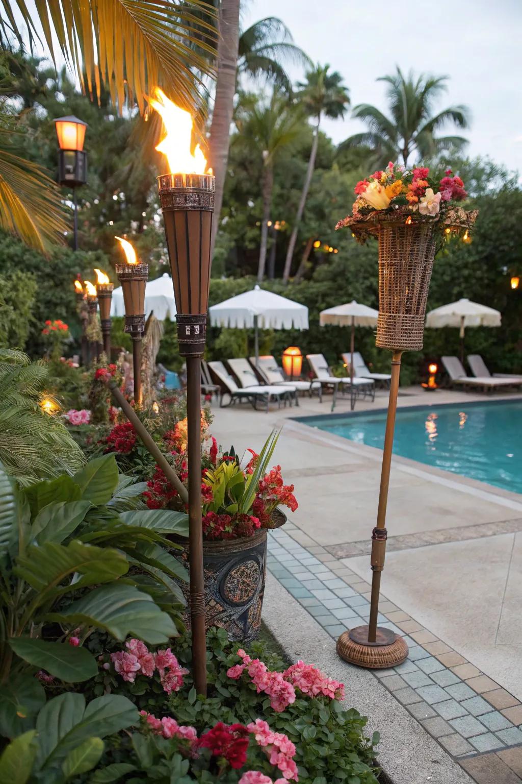 A poolside area with themed tropical decor and tiki torches.