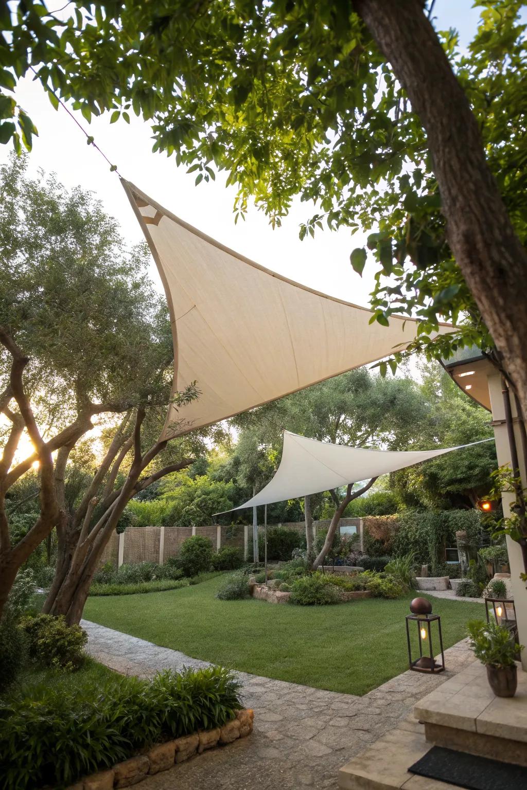 Sail shades naturally anchored by trees and existing structures in a backyard.