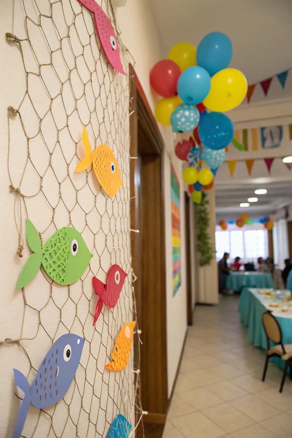 A fishing net backdrop with colorful fish cutouts adds charm.