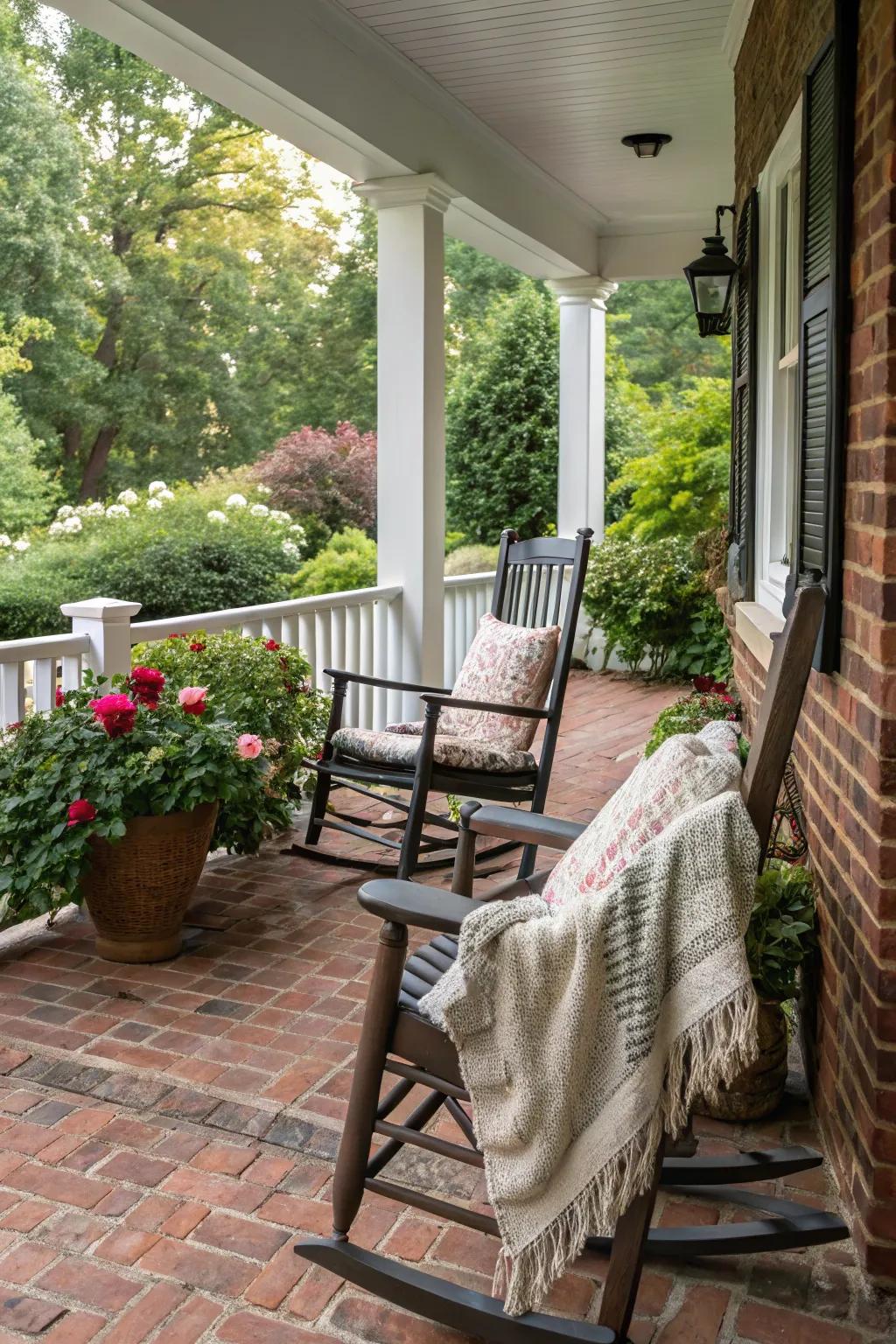 Cozy rocking chairs on a brick porch.