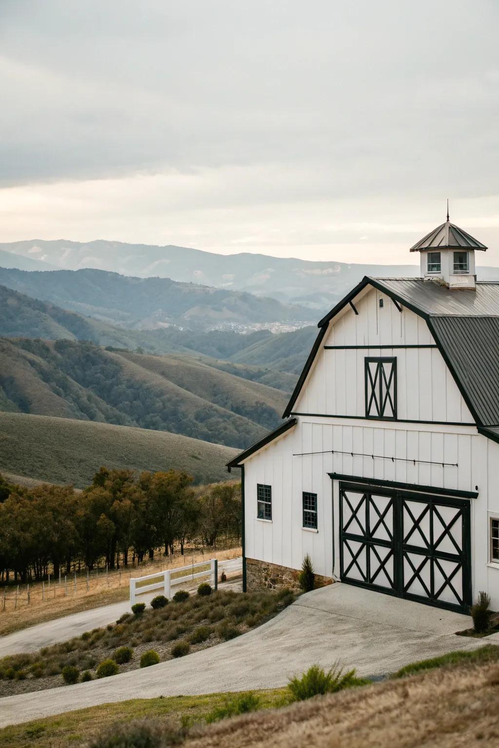 A bright white barn that stands out beautifully against the landscape.