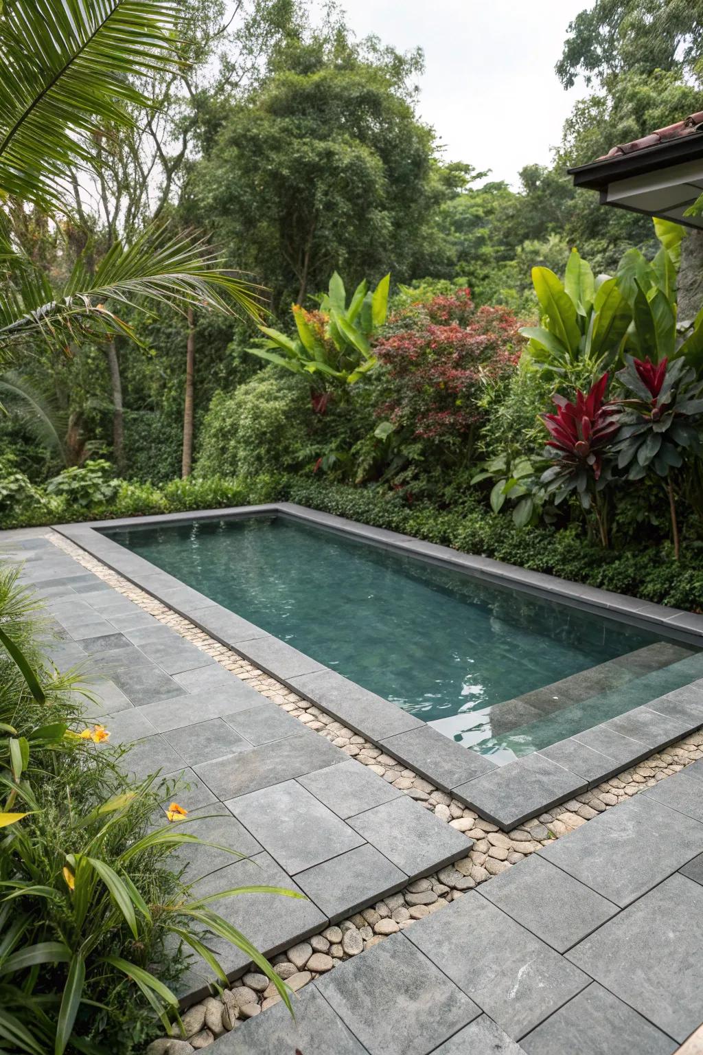 Pool embracing a natural stone aesthetic with grey tiles