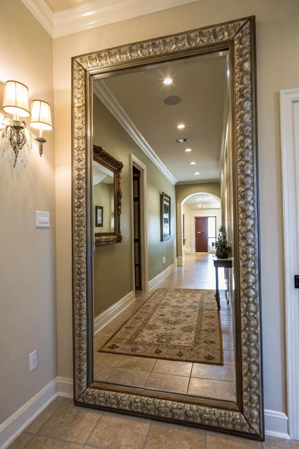 A large decorative mirror enhances light and space in this entryway.