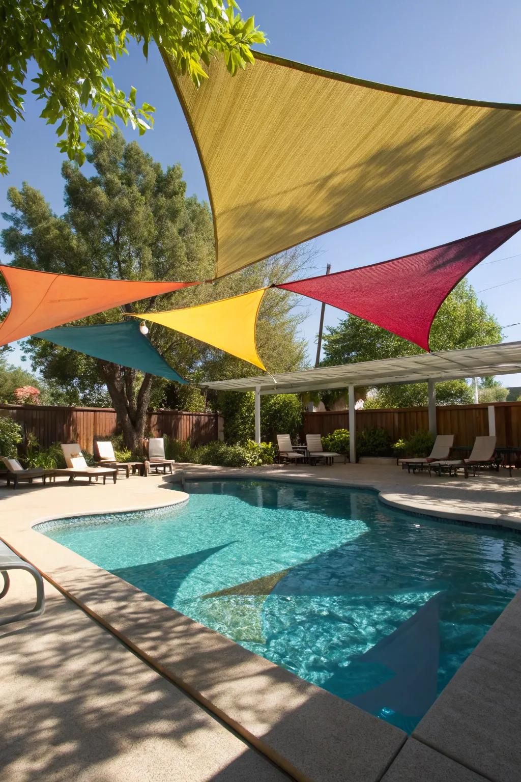 Shade sails adding a modern touch to a poolside setting.