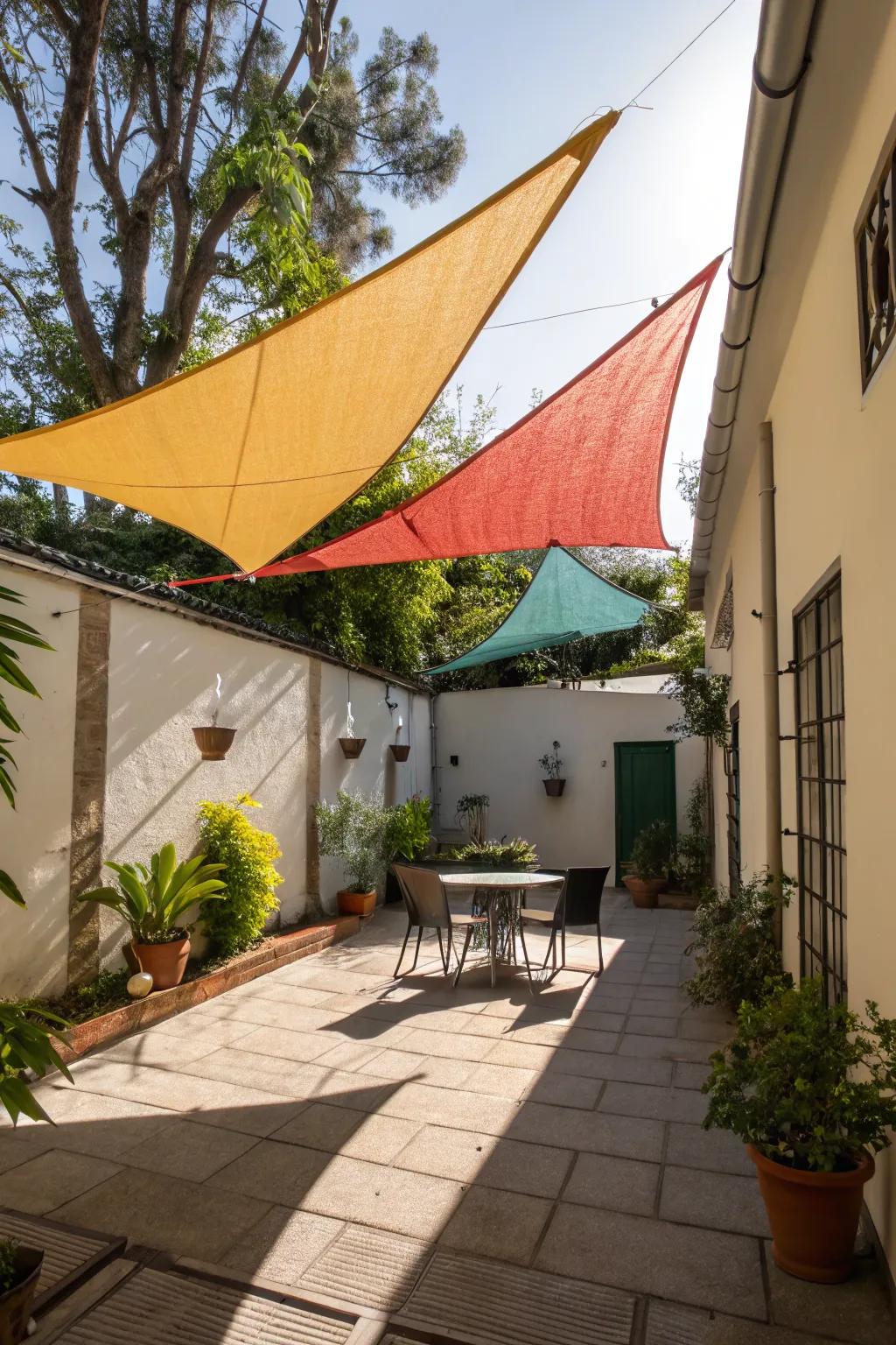 Sail shades offer a modern solution to patio shading.