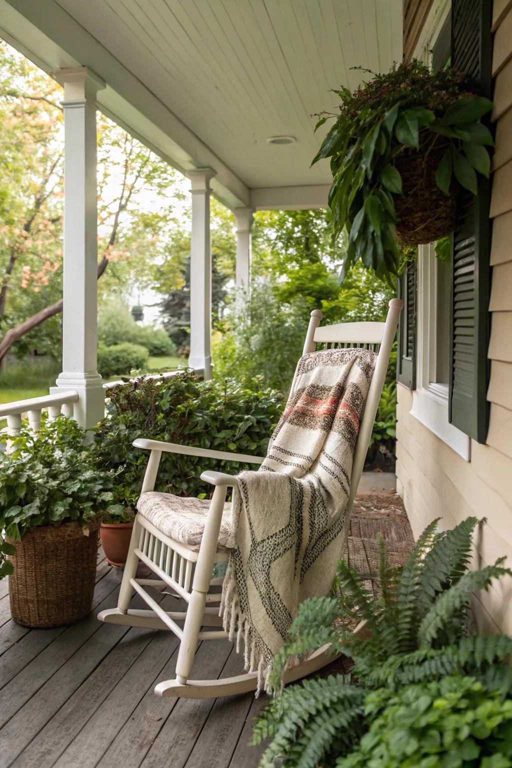 A rocking chair adds comfort and charm to a small porch.