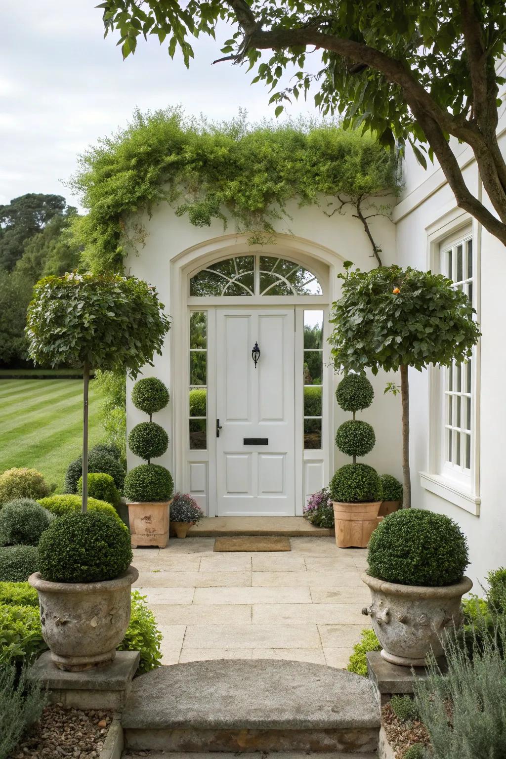 A white door framed by lush greenery.