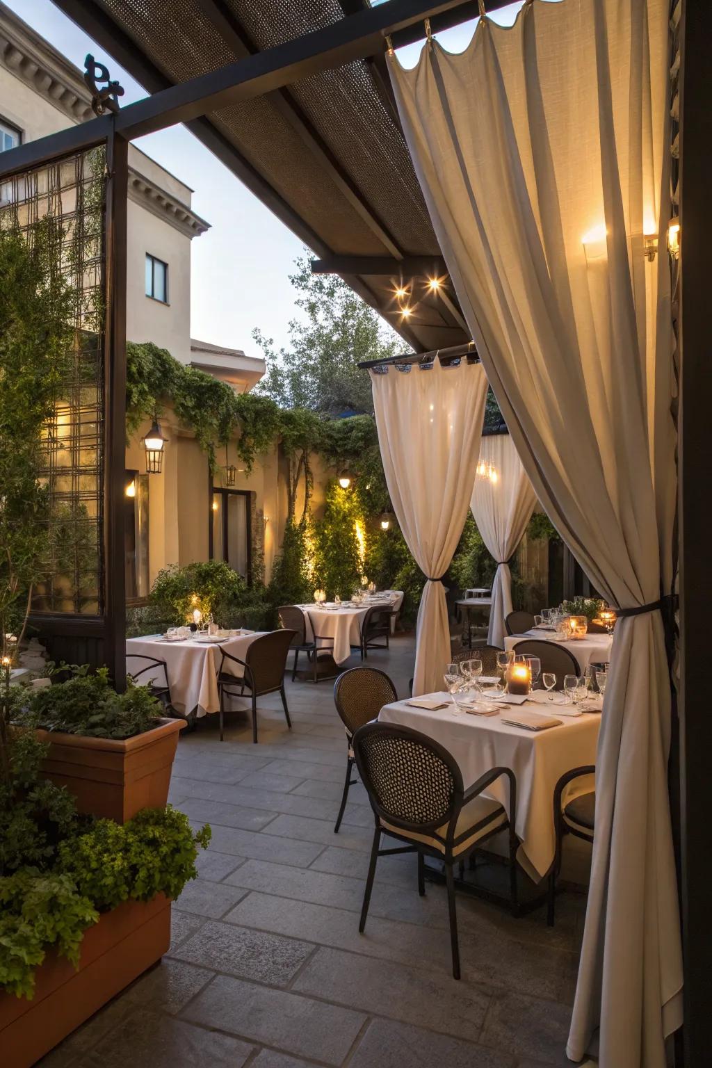 A cozy patio featuring soft outdoor curtains.