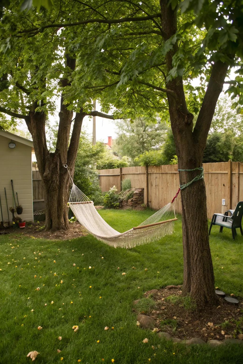 A hammock invites relaxation in a small backyard.