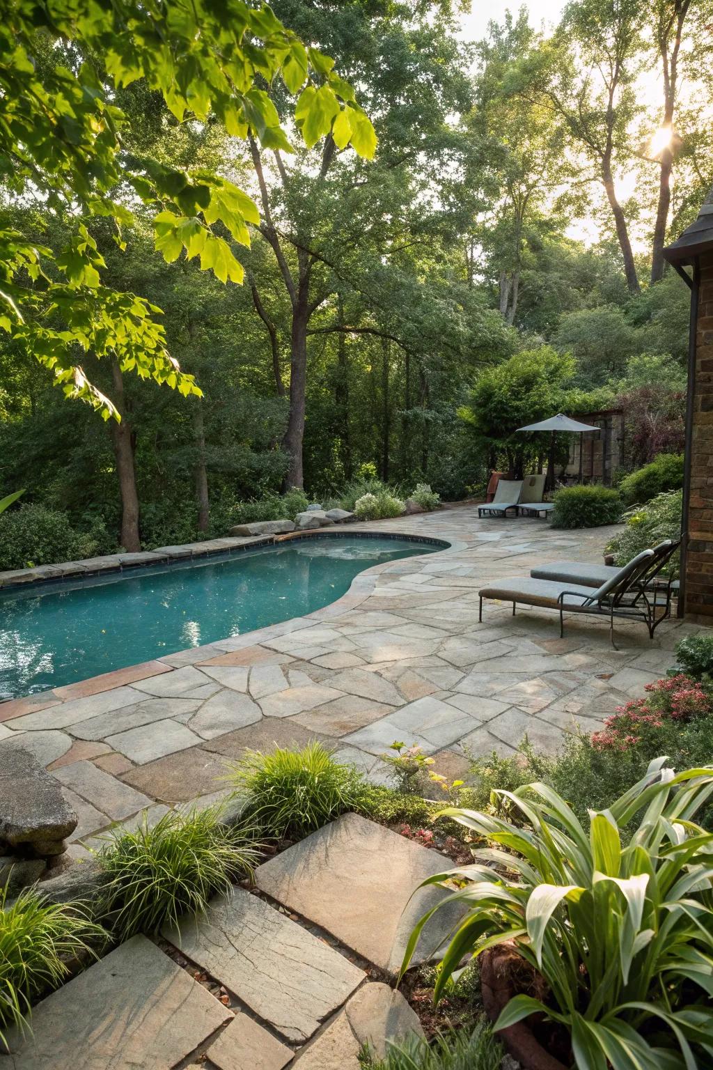 Elegant natural stone pavers enhancing the poolside area.