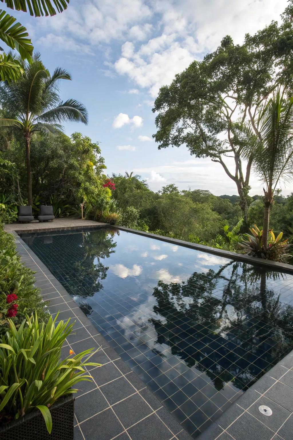 Reflective black tiles create a mesmerizing effect in this elegant pool.