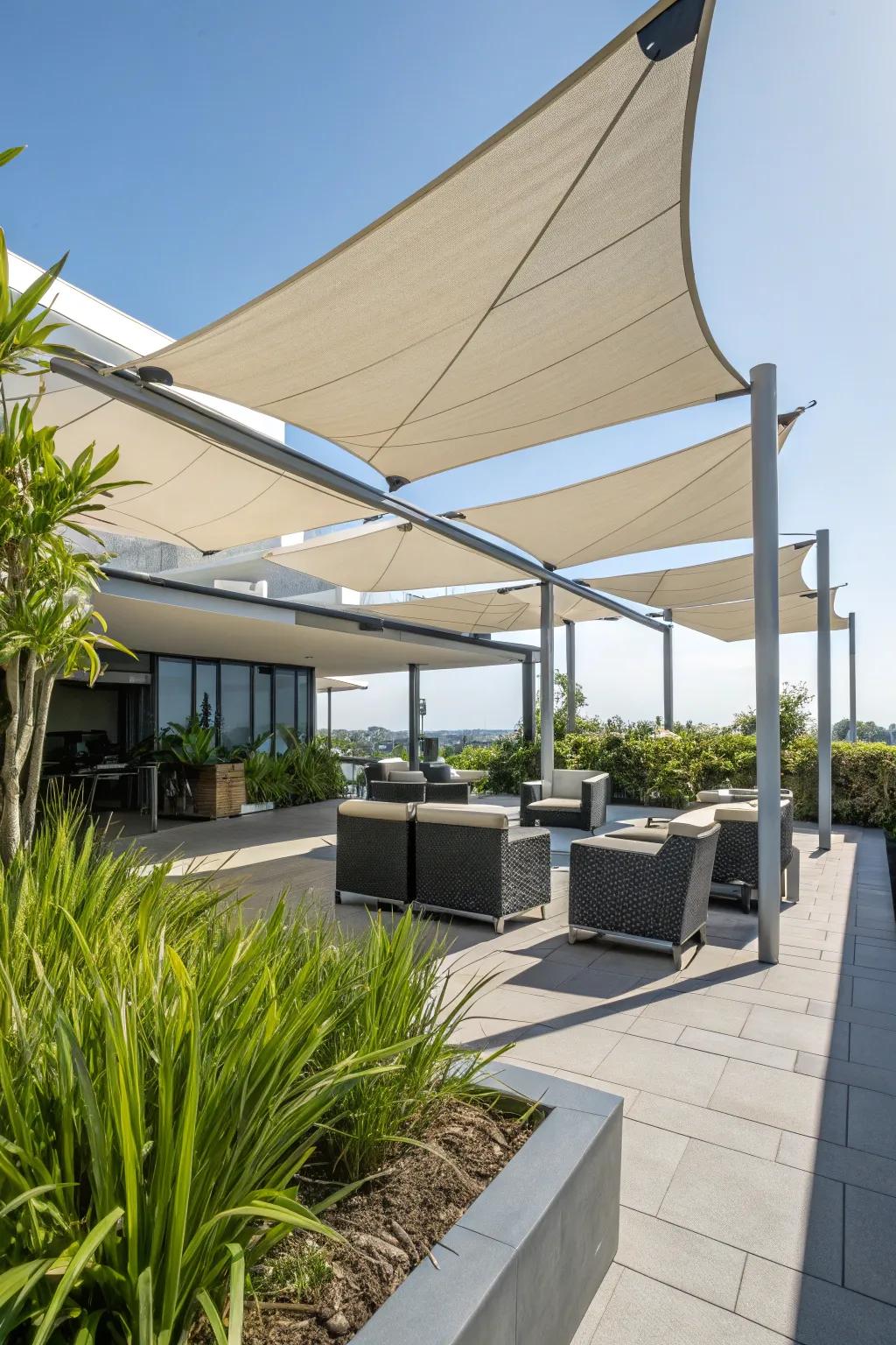 A patio enhanced with contemporary sail shade canopies.