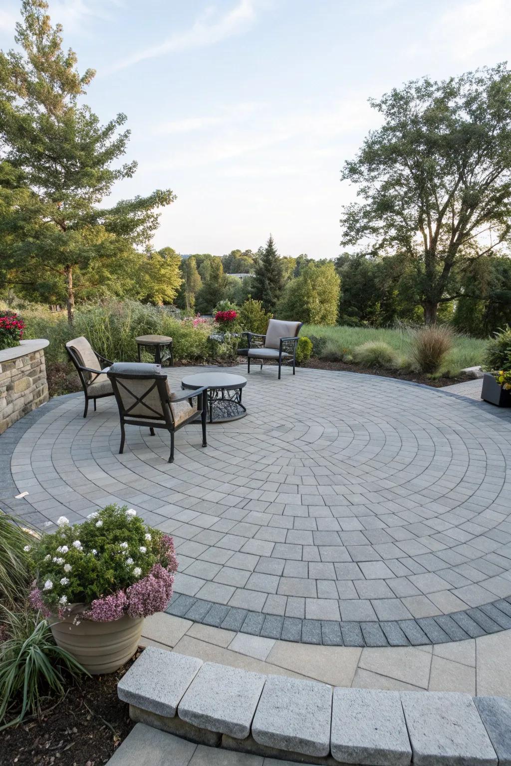 A circular gray paver patio designed for intimate conversations and gatherings.