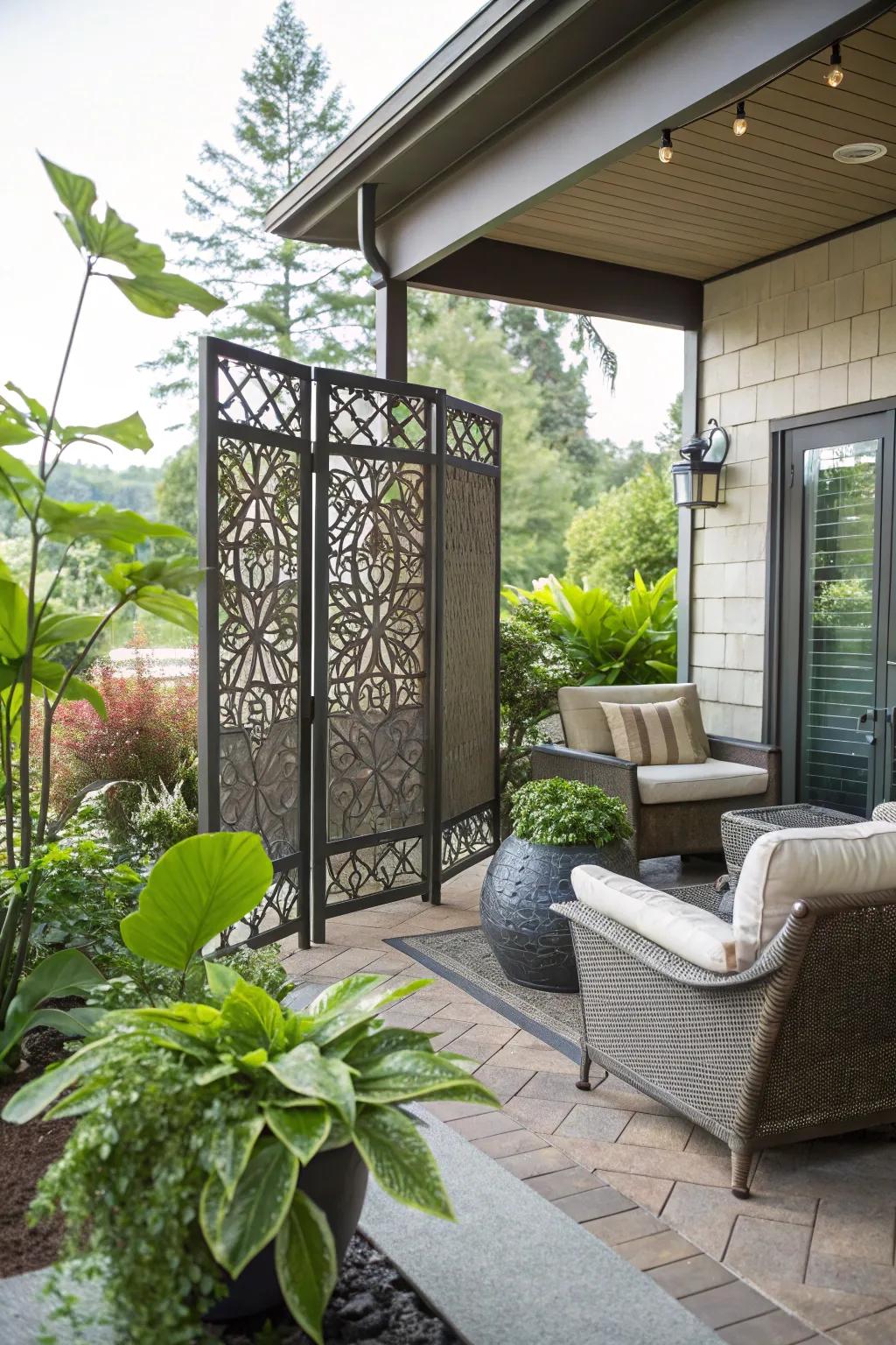 A decorative metal privacy screen transforming a patio into a private oasis.