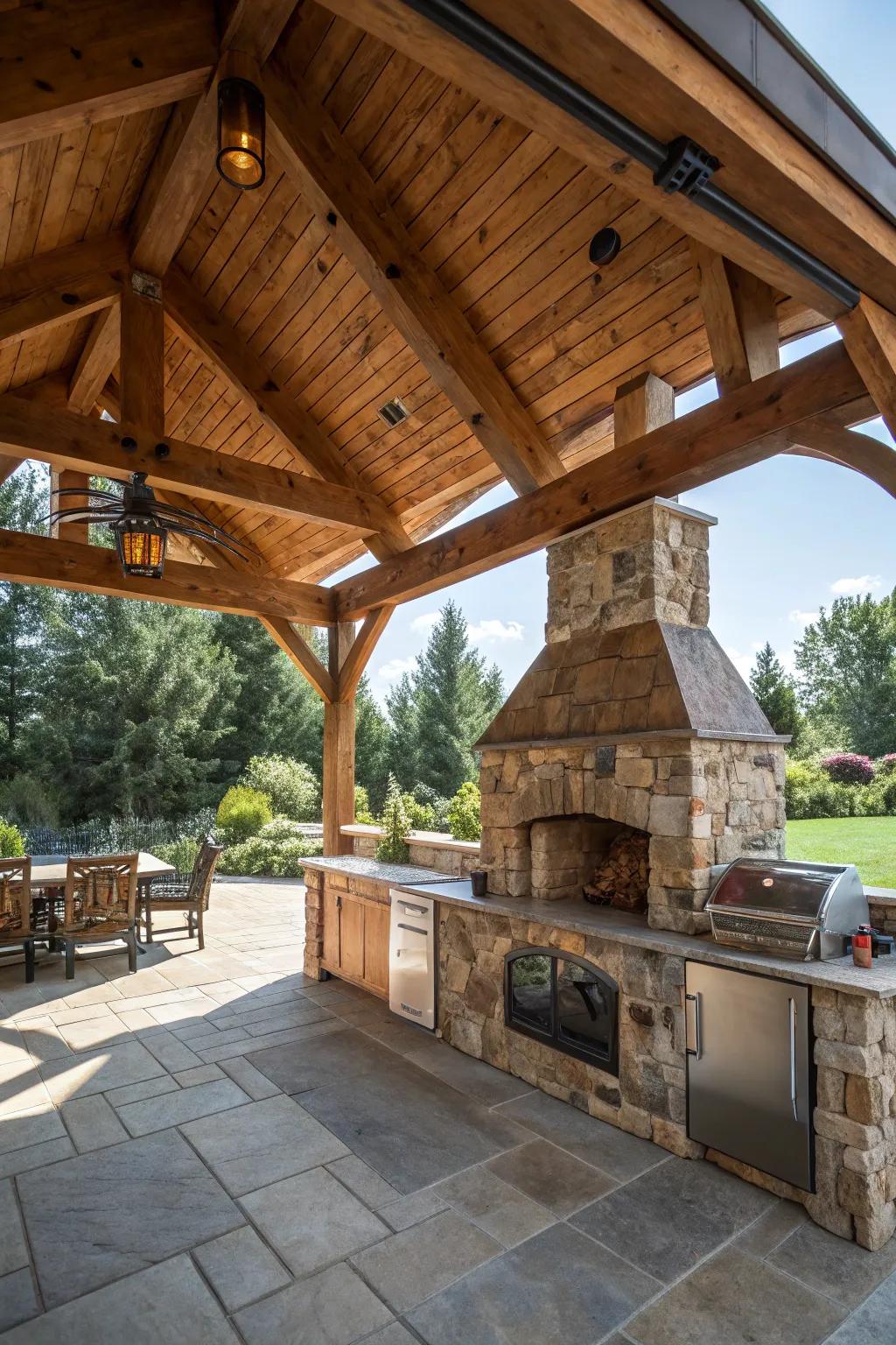 A rustic pavilion turns this outdoor kitchen into a cozy retreat.
