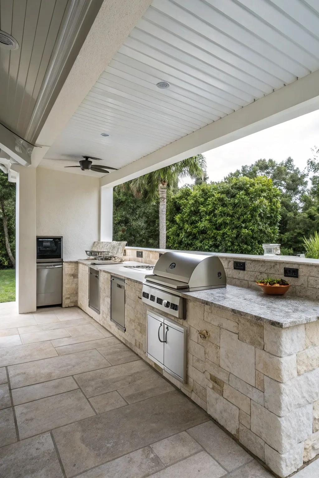 Stone and steel for a sleek, minimalist outdoor kitchen.