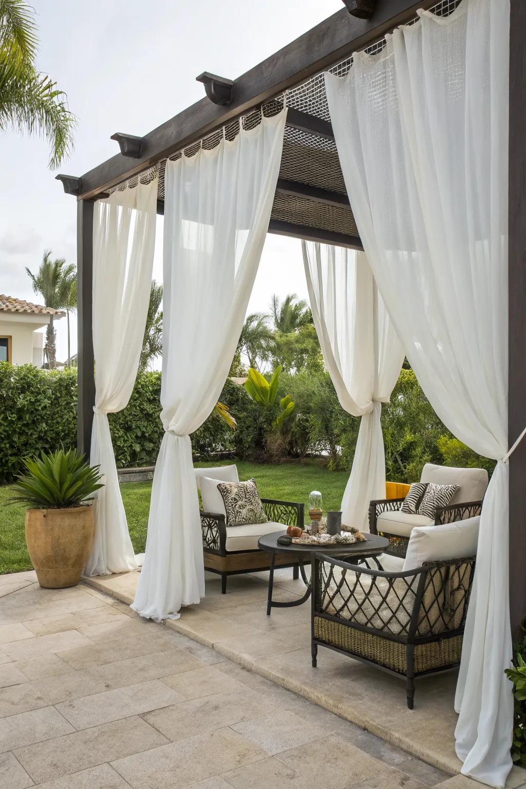 Outdoor curtains offer elegance and a tropical feel.