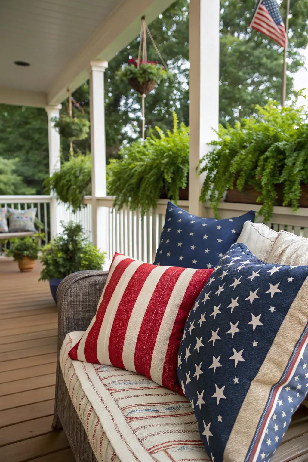 Patriotic pillows bring a cozy, festive feel to the porch seating area.