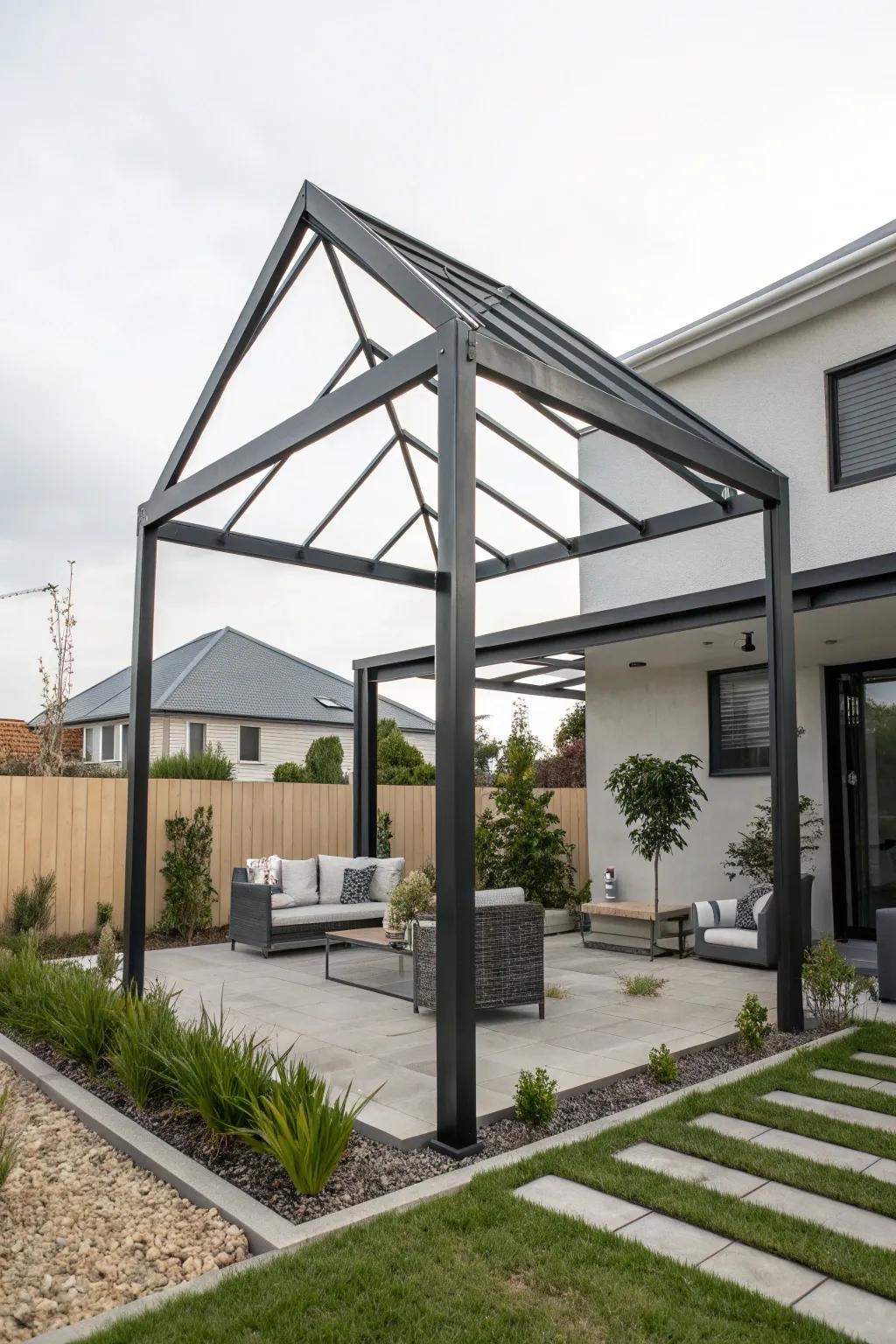 A chic, modern metal triangle pergola in a contemporary backyard.