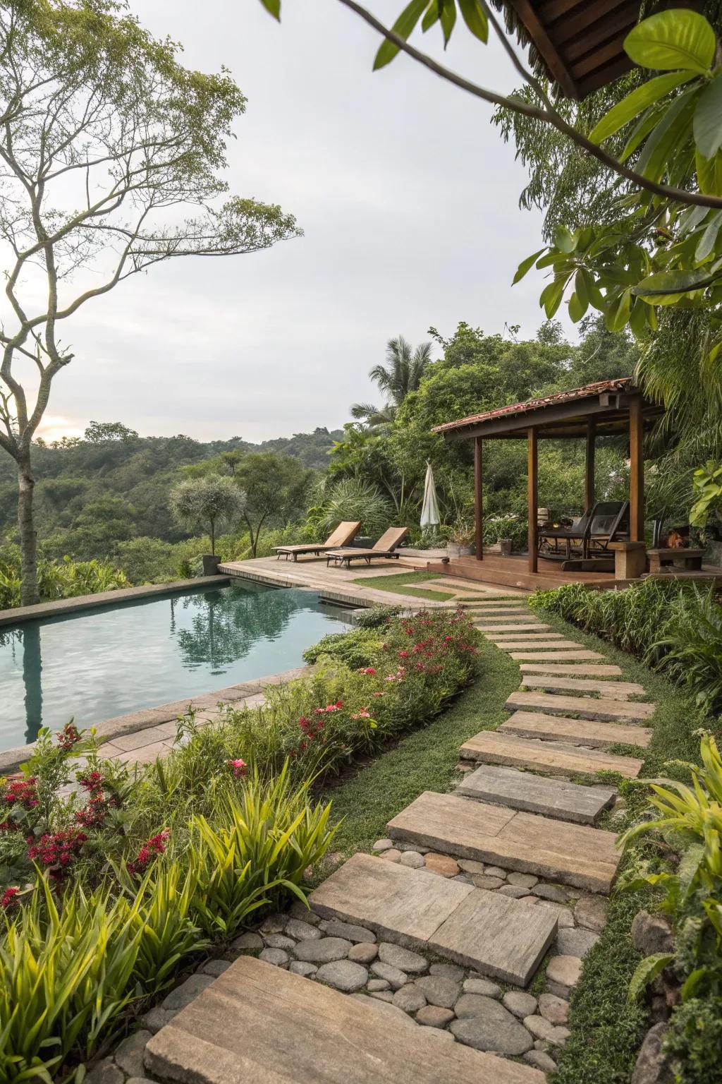 Natural stone pathways surrounded by greenery, seamlessly connecting pool and landscape.