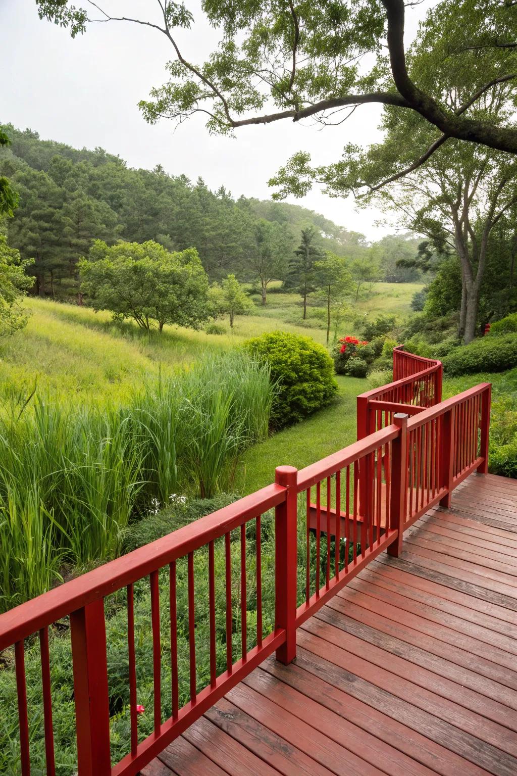Bold red railings add a striking contrast to a lush landscape.