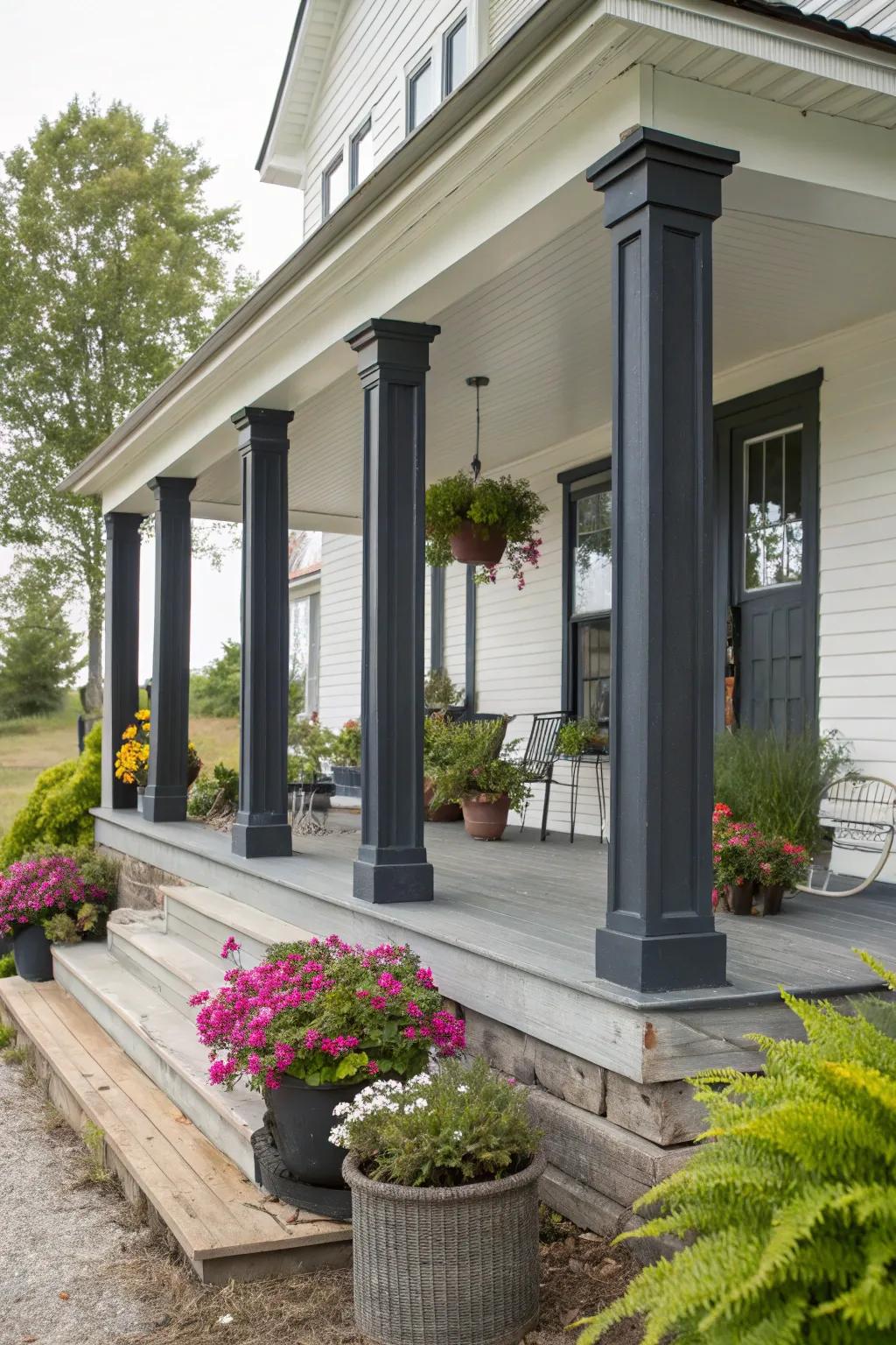 Dark gray columns stand out beautifully against a white farmhouse.