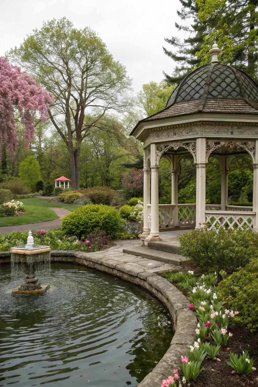 A peaceful gazebo with a nearby water feature.