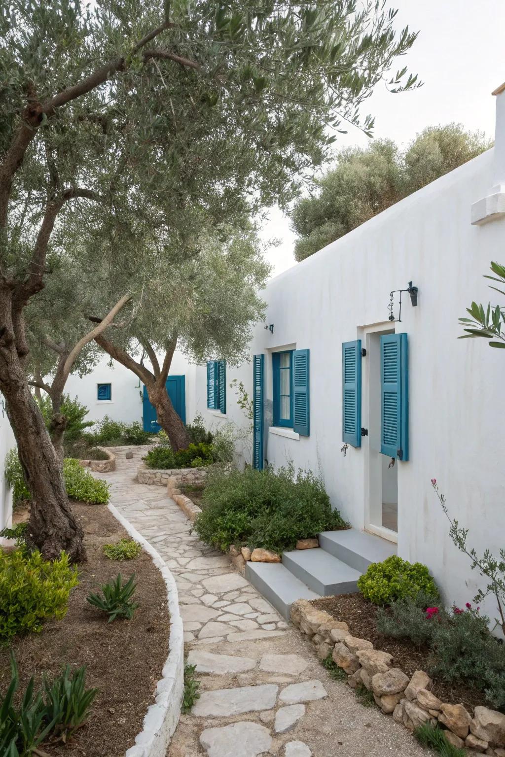 White and blue accents bring a fresh, Mediterranean vibe to gardens.