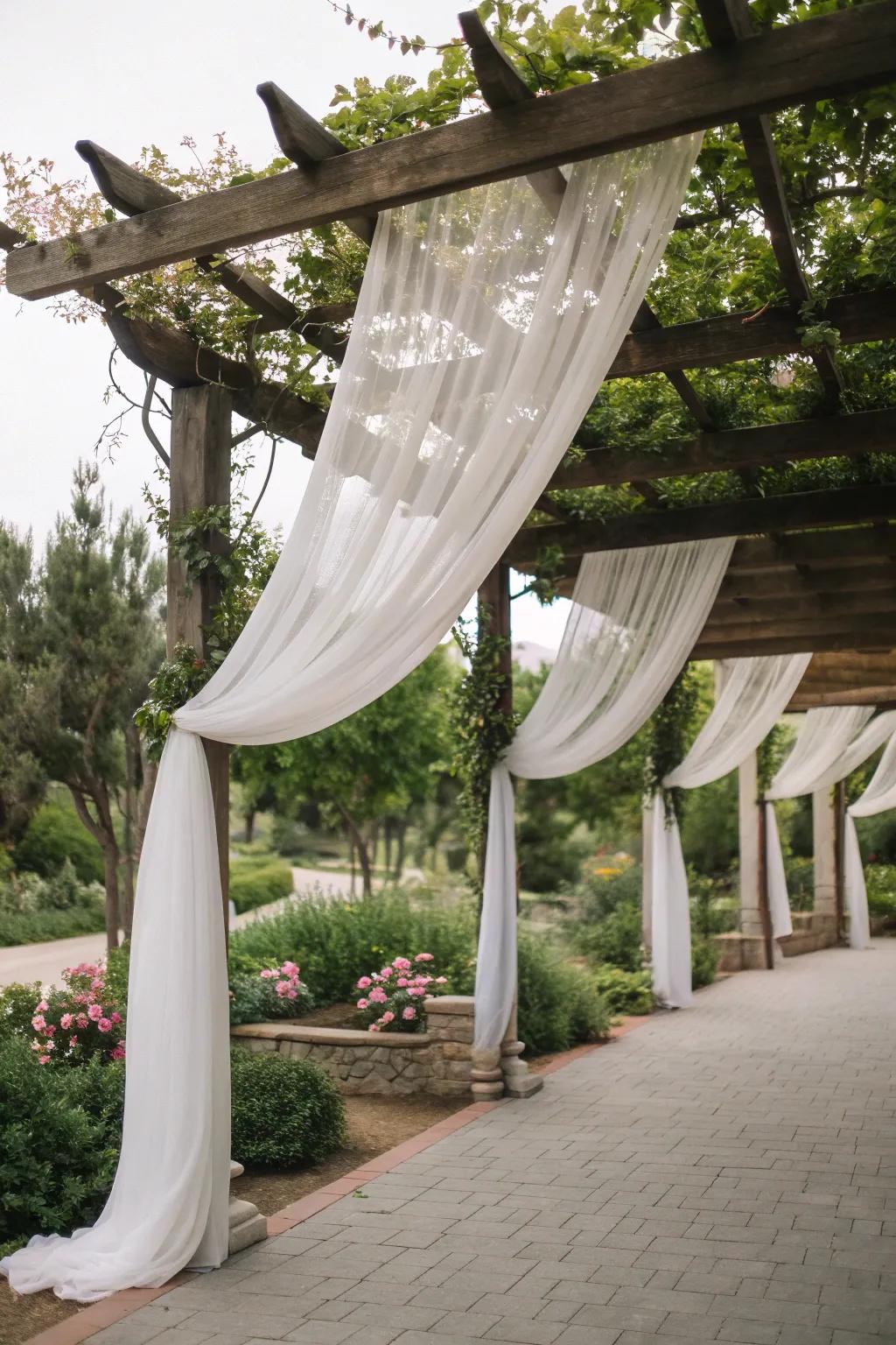 Flowing drapery adds elegance and romance to this pergola.