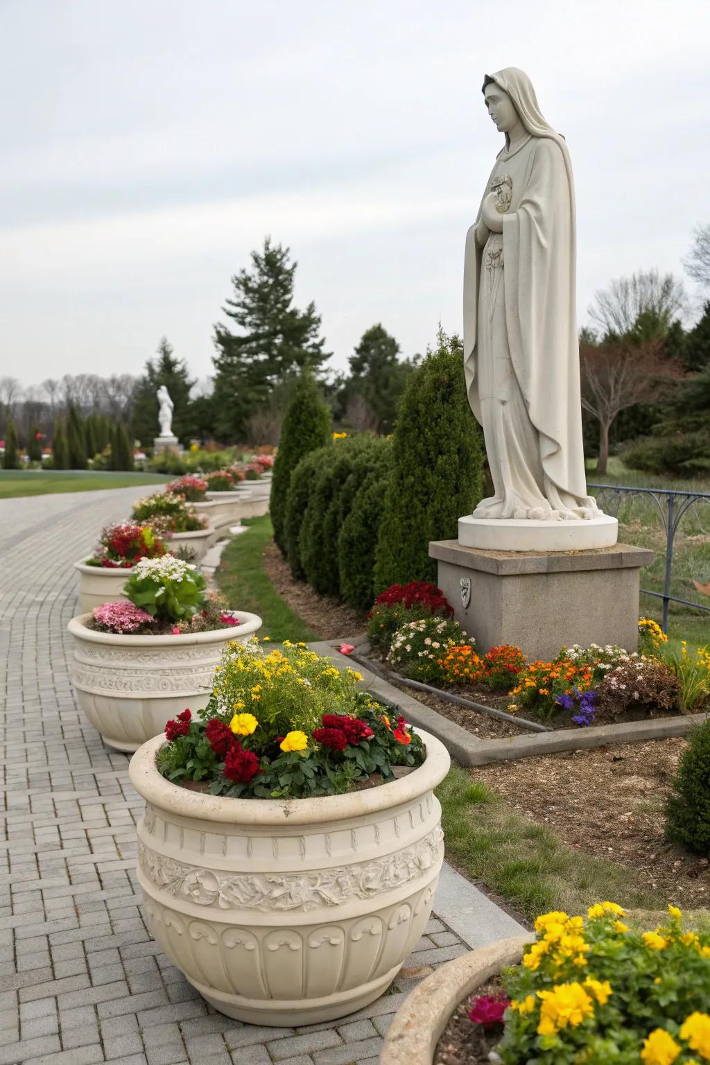 Seasonal blooms in decorative planters enhance a Mary garden's beauty.